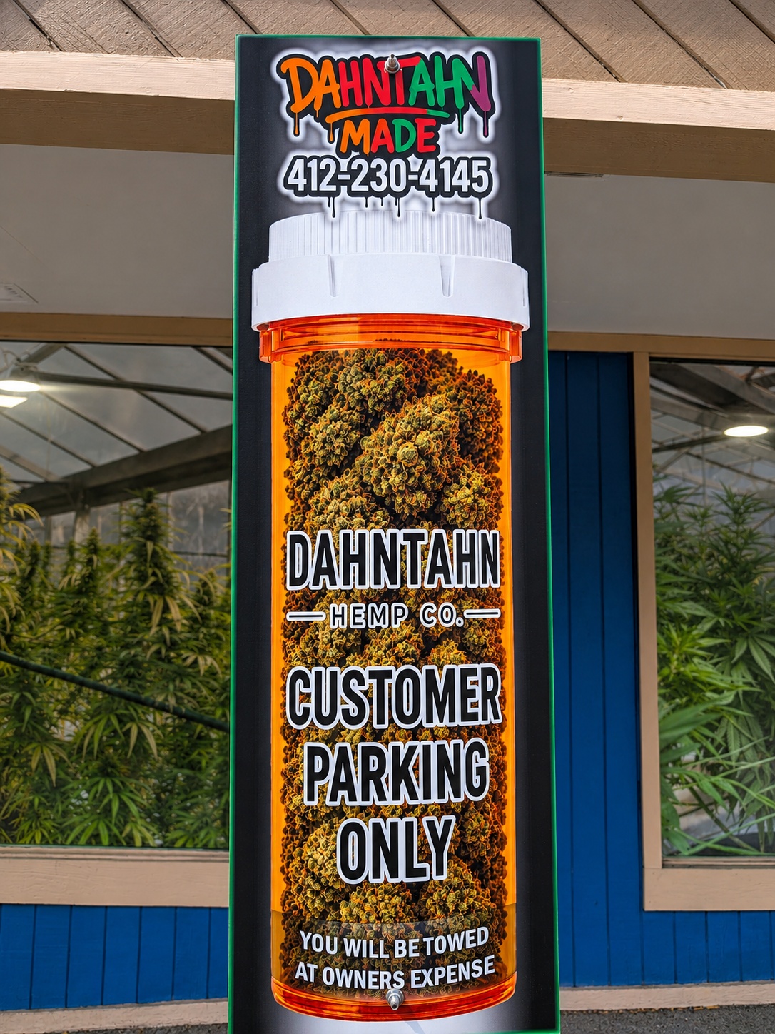 Custom Dahntahn Hemp Co. customer parking sign mounted outside the storefront
